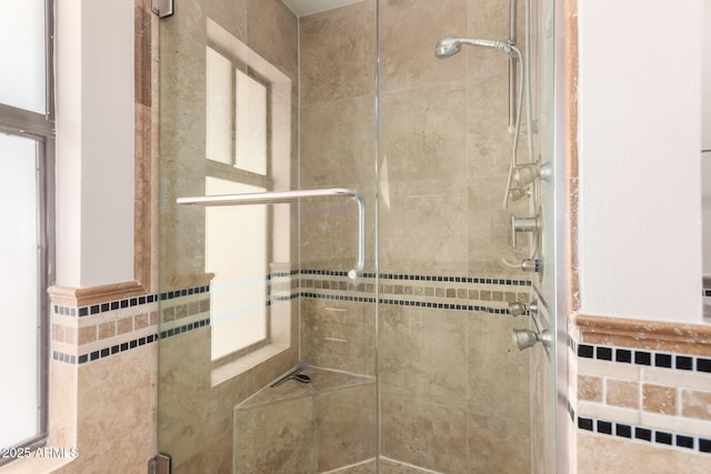 bathroom featuring a shower stall