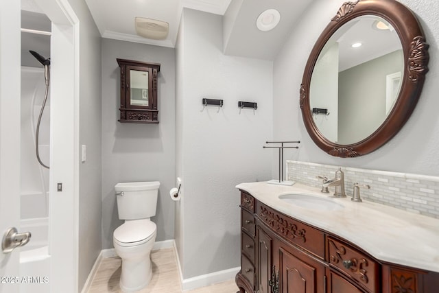 bathroom with tasteful backsplash, walk in shower, toilet, ornamental molding, and vanity