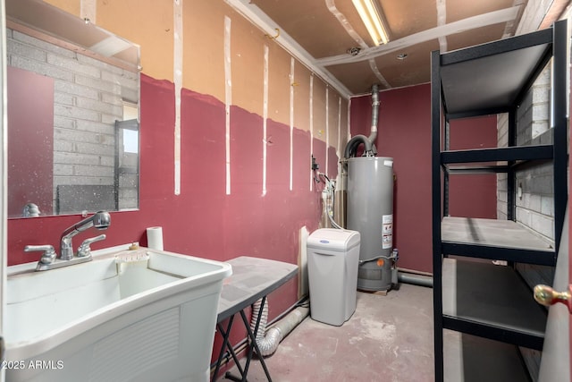interior space with water heater and a sink