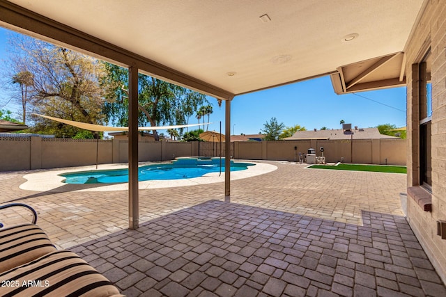 view of pool with a fenced in pool, a fenced backyard, and a patio area