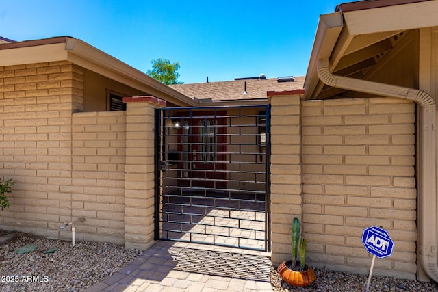 view of gate with fence