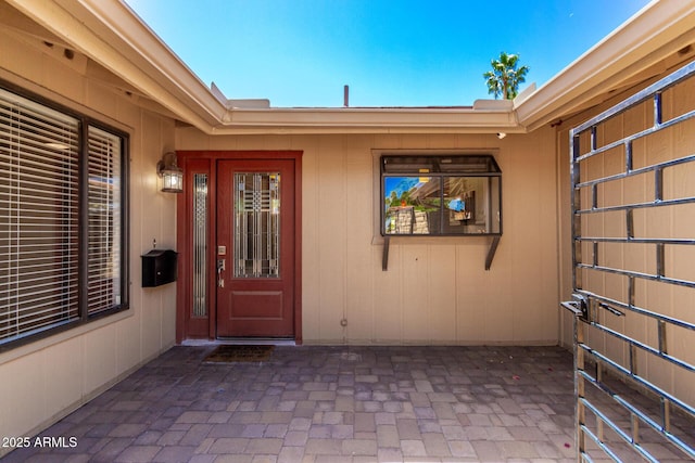 doorway to property featuring a patio area