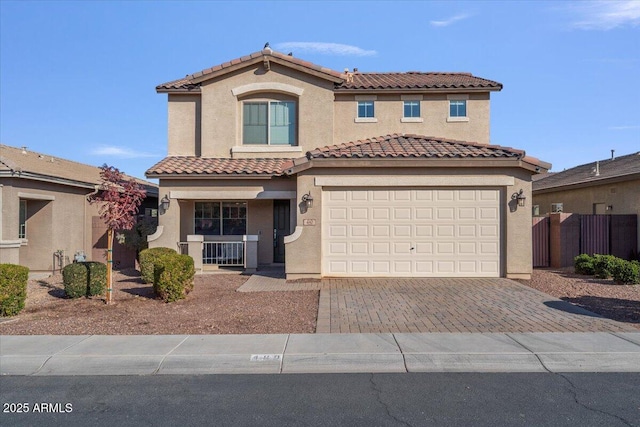 mediterranean / spanish-style house featuring a garage