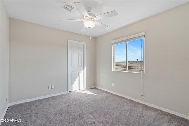 unfurnished room featuring ceiling fan and light carpet