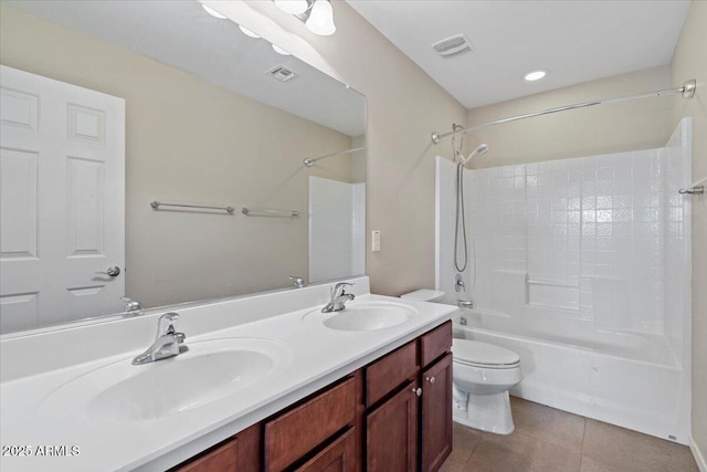 full bathroom featuring vanity, tub / shower combination, tile patterned floors, and toilet