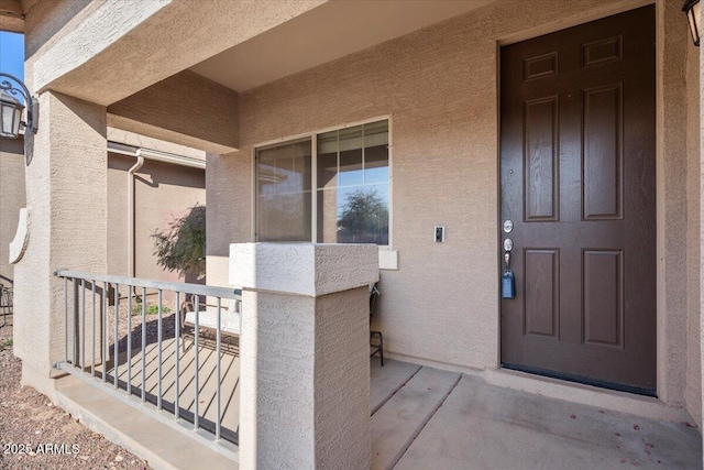 entrance to property with a porch