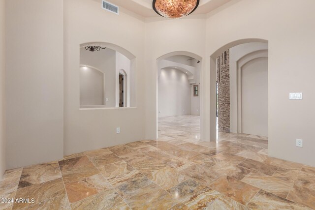 3730 E Cloud Rd, Cave Creek, AZ 85331 - empty room featuring arched walkways, a towering ceiling, and visible vents