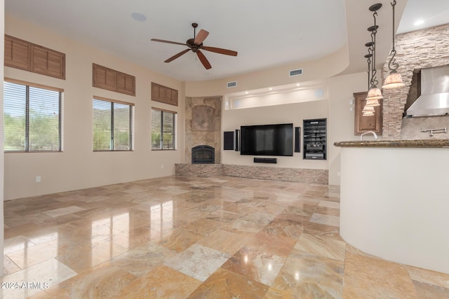 3730 E Cloud Rd, Cave Creek, AZ 85331 - unfurnished living room with visible vents, a fireplace, and ceiling fan