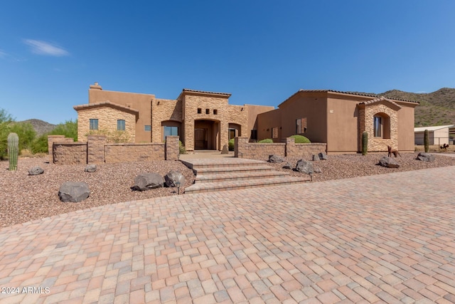 3730 E Cloud Rd, Cave Creek, AZ 85331 - view of front facade featuring stucco siding, fence, and a mountain view