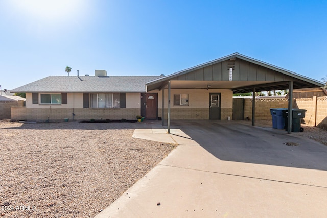 ranch-style home with a carport