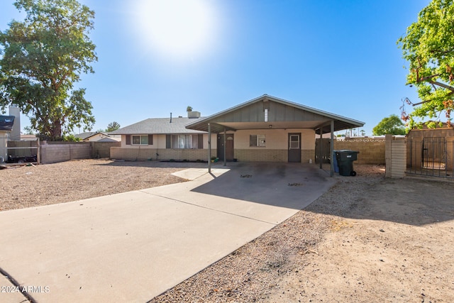 view of front of property with a carport