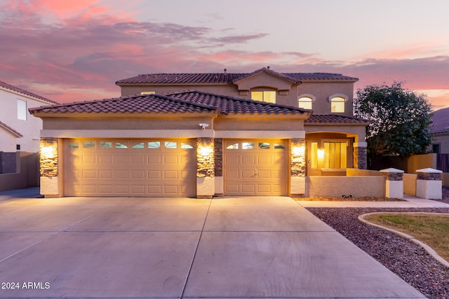 mediterranean / spanish-style home featuring a garage