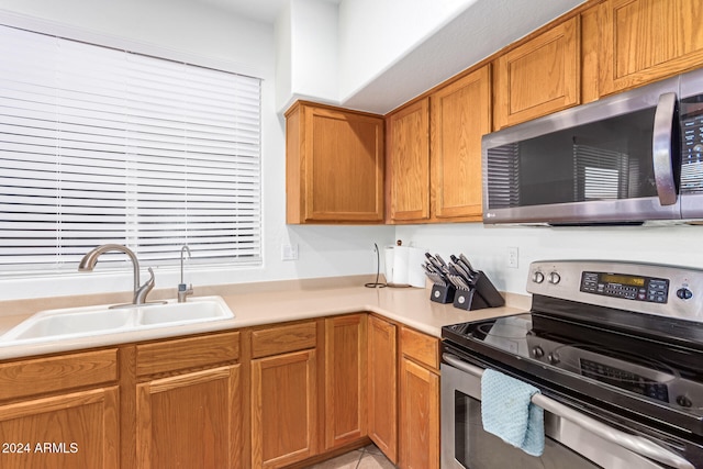 kitchen featuring stainless steel appliances and sink