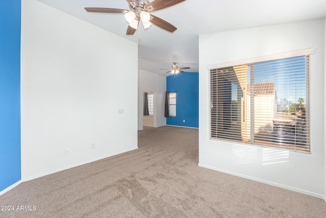 carpeted empty room with ceiling fan