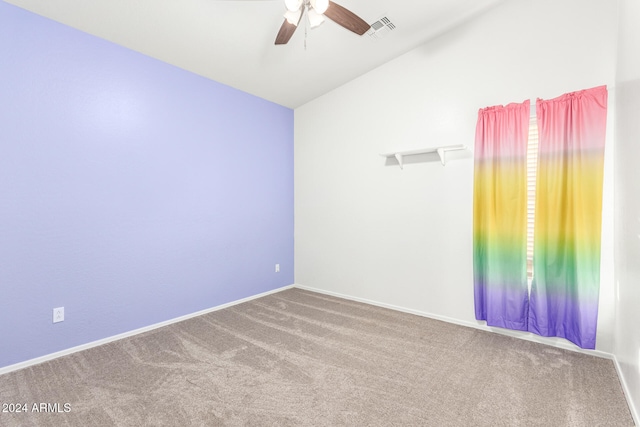 empty room featuring carpet, lofted ceiling, and ceiling fan