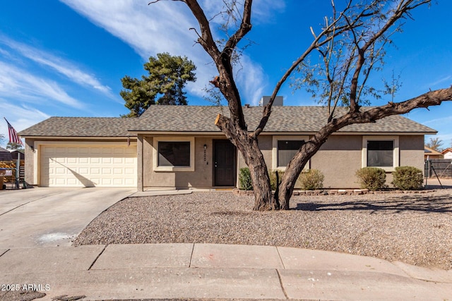 ranch-style house featuring a garage, roof with shingles, concrete driveway, and stucco siding