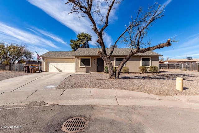 ranch-style house featuring a garage, driveway, fence, and stucco siding