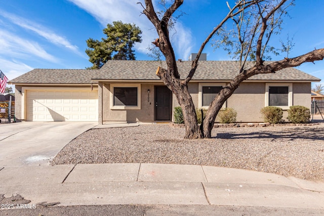 ranch-style house featuring concrete driveway, a shingled roof, an attached garage, and stucco siding