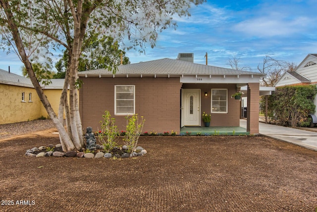 view of front of house with roof with shingles and a porch