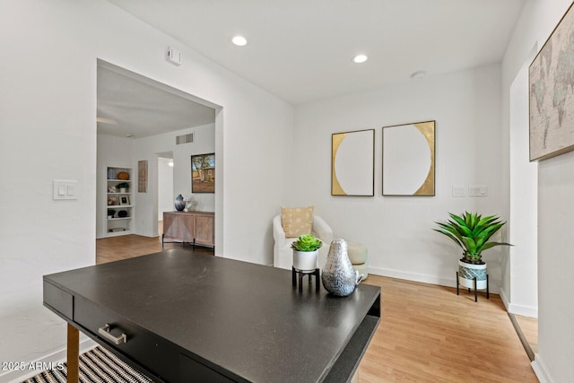 home office with visible vents, recessed lighting, light wood-type flooring, and baseboards