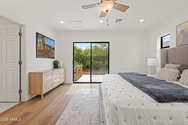 bedroom featuring access to exterior, visible vents, multiple windows, and light wood finished floors