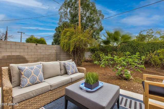 view of patio / terrace with an outdoor living space and a fenced backyard