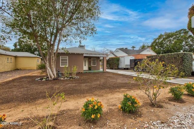 view of front of property with a porch and concrete driveway