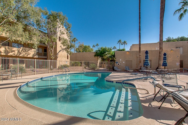 view of swimming pool featuring a patio area