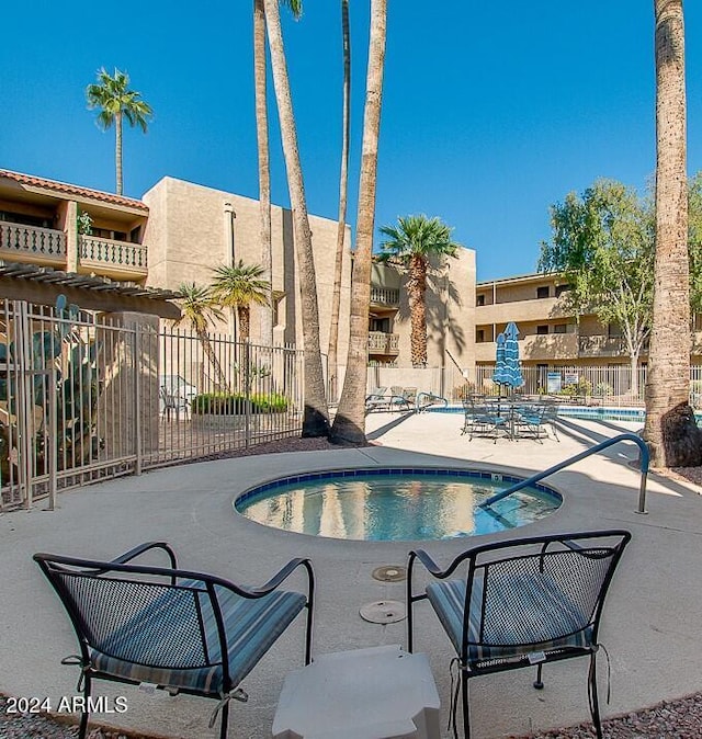 view of swimming pool with a patio area