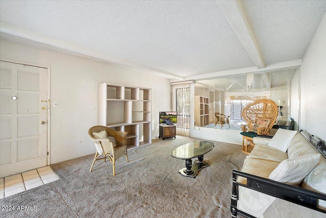 living room with a textured ceiling, beamed ceiling, and tile patterned flooring