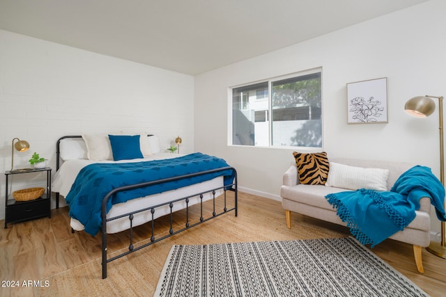 bedroom with wood-type flooring