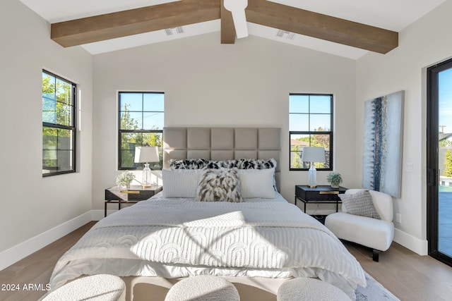 bedroom with lofted ceiling with beams and wood-type flooring