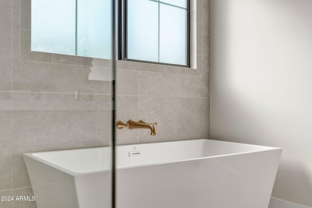 bathroom featuring a bathtub and sink