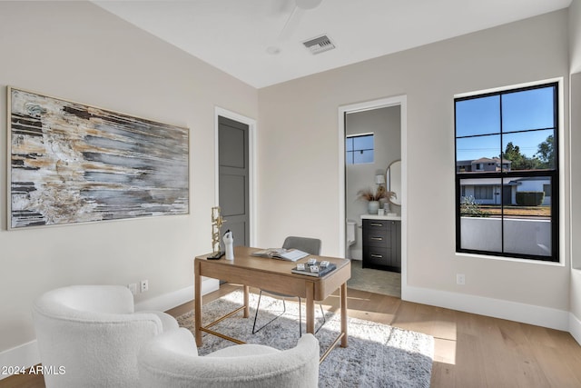 office space with light hardwood / wood-style flooring