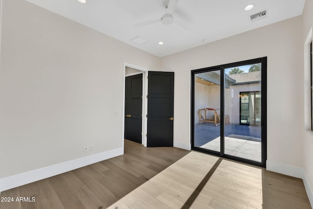 interior space featuring hardwood / wood-style floors and ceiling fan