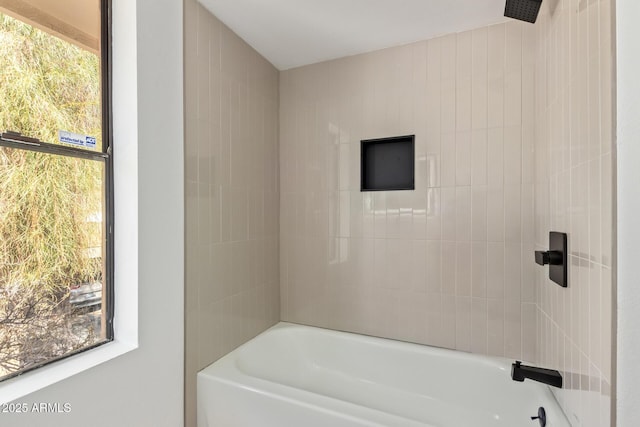 bathroom with  shower combination and a wealth of natural light