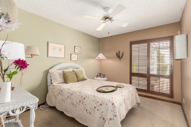 4024 W Griswold Rd, Phoenix, AZ 85051 - bedroom featuring carpet flooring, baseboards, a textured ceiling, and a ceiling fan