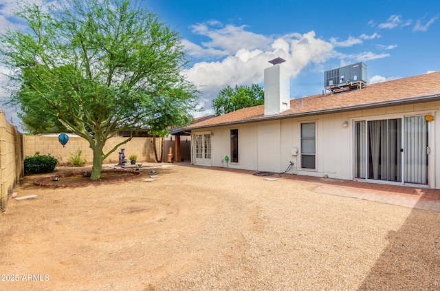 4024 W Griswold Rd, Phoenix, AZ 85051 - back of house with a fenced backyard, a chimney, and a patio area