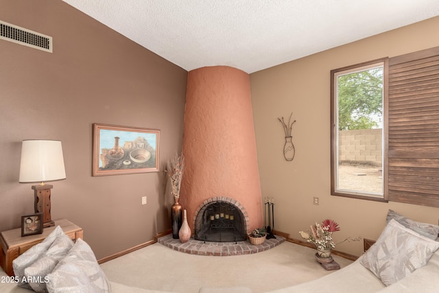4024 W Griswold Rd, Phoenix, AZ 85051 - carpeted living room with a brick fireplace, baseboards, and a textured ceiling