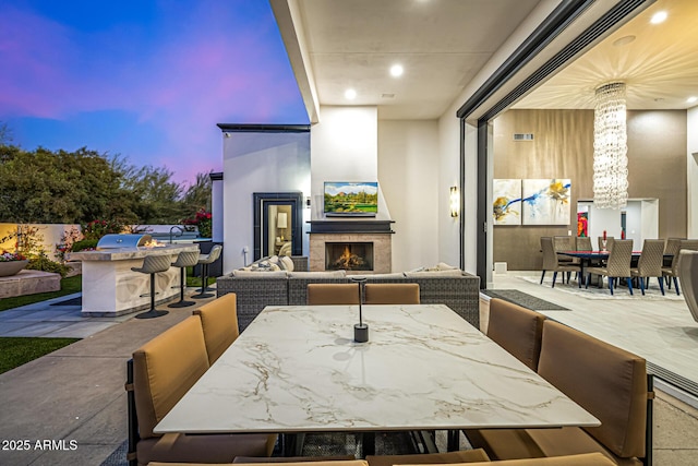 5404 N 41st St, Phoenix, AZ 85018 - view of patio / terrace with outdoor dining area and an outdoor living space with a fireplace