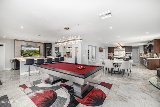 5404 N 41st St, Phoenix, AZ 85018 - recreation room featuring recessed lighting, light marble finish floors, and pool table