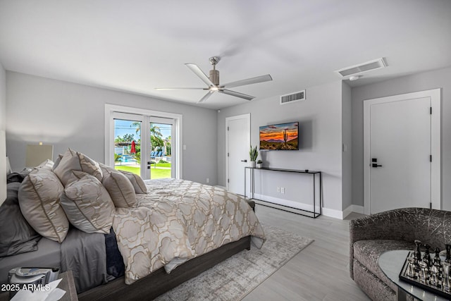 5404 N 41st St, Phoenix, AZ 85018 - bedroom with access to outside, wood finished floors, ceiling fan, and baseboards
