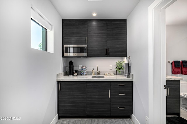 5404 N 41st St, Phoenix, AZ 85018 - indoor wet bar featuring stainless steel microwave and baseboards