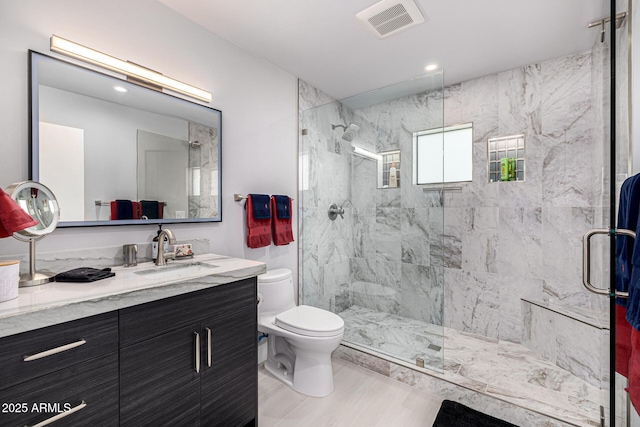 5404 N 41st St, Phoenix, AZ 85018 - full bath featuring toilet, a marble finish shower, vanity, and recessed lighting