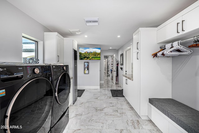 5404 N 41st St, Phoenix, AZ 85018 - washroom featuring independent washer and dryer, cabinet space, recessed lighting, light marble finish flooring, and baseboards