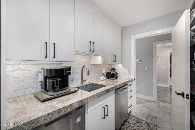 5404 N 41st St, Phoenix, AZ 85018 - kitchen featuring a sink, stainless steel dishwasher, light marble finish floors, tasteful backsplash, and white cabinetry