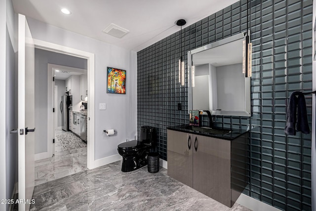 5404 N 41st St, Phoenix, AZ 85018 - bathroom featuring baseboards, vanity, marble finish flooring, toilet, and recessed lighting
