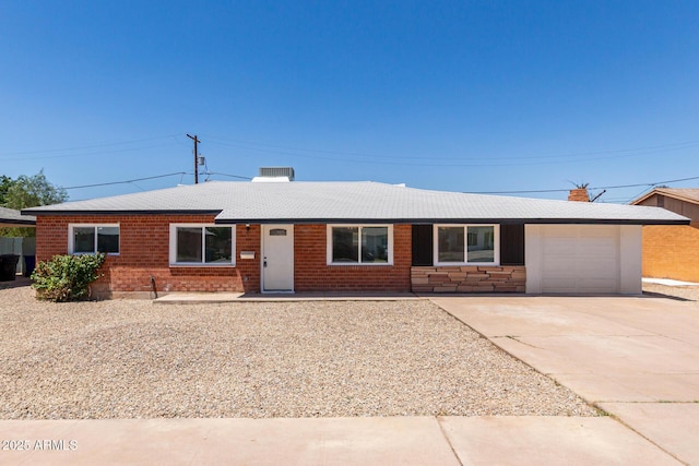 1028 W 5th St, Mesa, AZ 85201 - ranch-style house with a garage, concrete driveway, brick siding, and a chimney