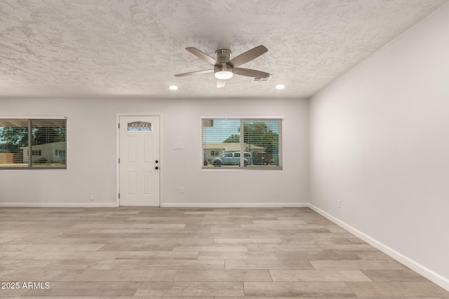 1028 W 5th St, Mesa, AZ 85201 - spare room with ceiling fan, light wood finished floors, a textured ceiling, baseboards, and recessed lighting