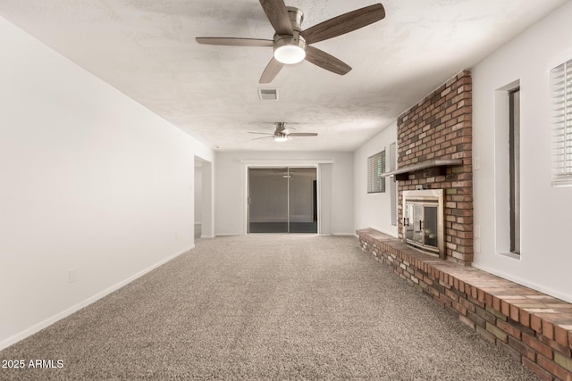 1028 W 5th St, Mesa, AZ 85201 - unfurnished living room with a ceiling fan, carpet, a fireplace, and baseboards